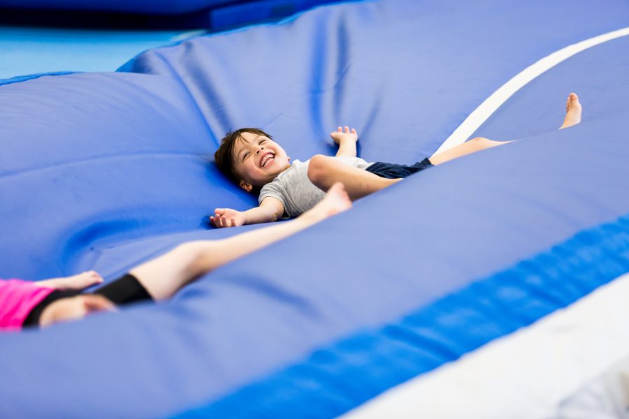 boy fun with inflation airtrack airgym