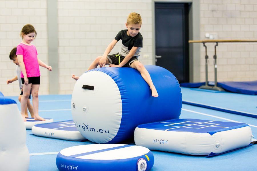 child playing on airbarrel and hotspot airgym
